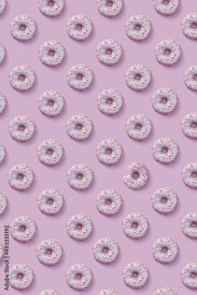 Pattern of glazed donuts with sprinkles Pattern of glazed donuts with sprinkles