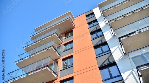 Modern european residential architecture on a sunny day. Exterior of new multi-story residential building. Concept of sale and rental of apartments for  consumers .Modern windows and balconies.