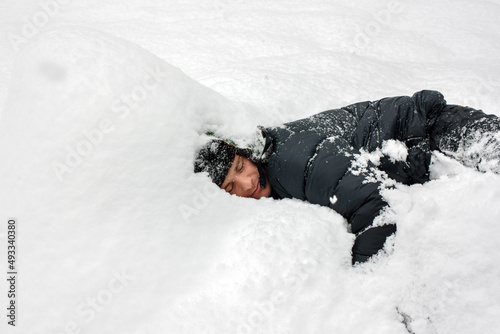 Sleeping in a snowbank photo