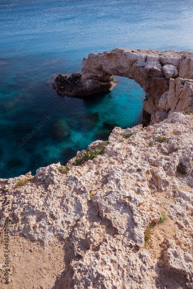 view of the bridge of lovers on the seashore with rocks in ayia napa