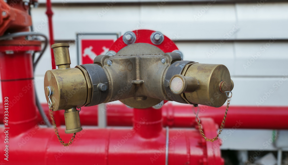Closeup plate at end of hydrant with water hoses new industrial fire control Closeup plate at end of hydrant with water hoses new industrial fire control