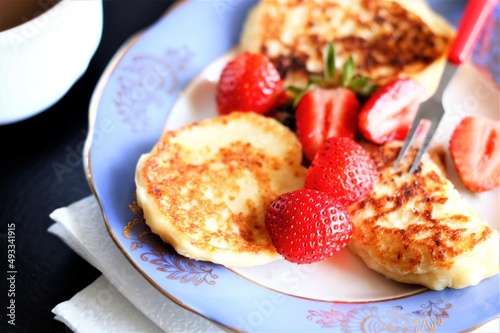 Closeup pancakes with strawberries food eat delicious sweet dessert bakery tasty pastry nobody sugar cup table 