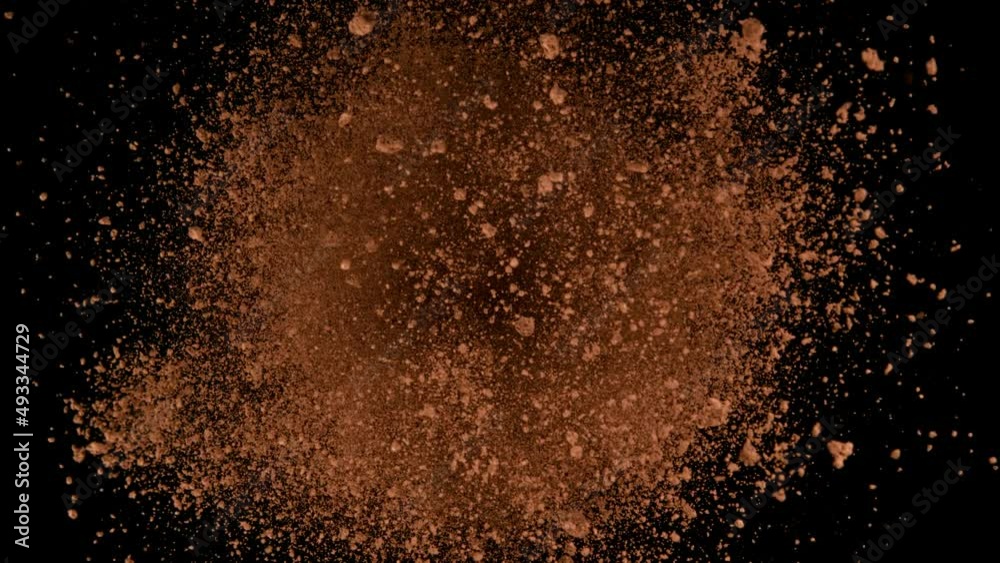 Super slow motion of ground coffee powder rotation on black background. Filmed on high speed cinema camera, 1000fps. Speed ramp effect.