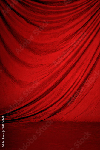 Red draped fabric, great as portrait studio background or theater, stage or show curtain.