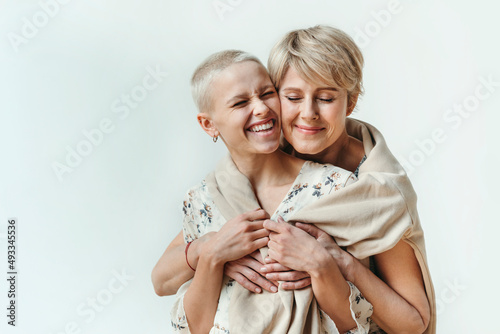 Happy hugging women.