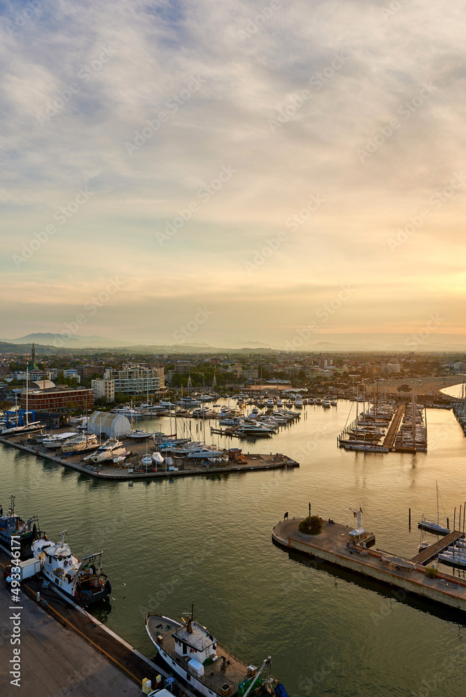 Fototapeta premium Aerial view of Rimini sea port with ships and blue water.
