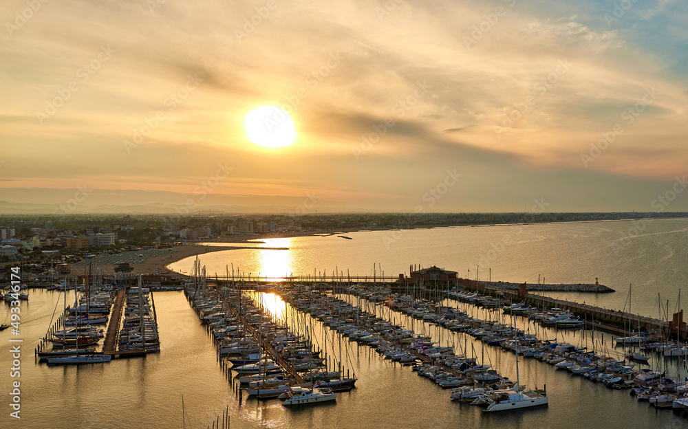 Obraz premium Aerial view of Rimini sea port with ships and blue water.