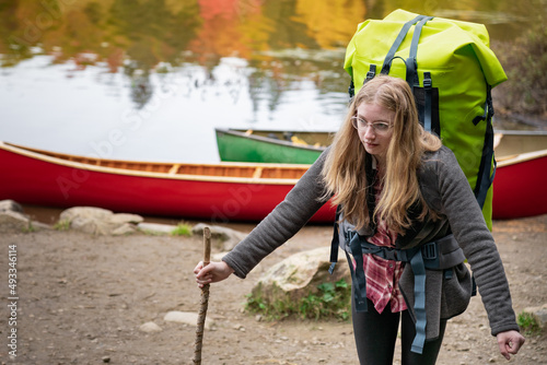 Teen Girl Carrying Large Canoe Pack Portage photo