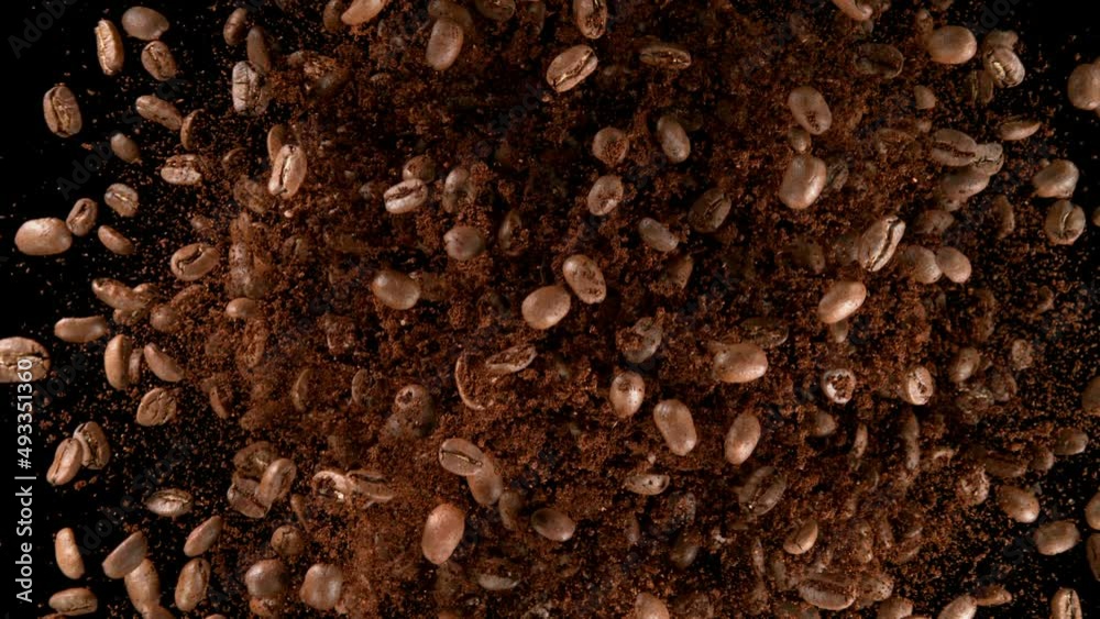 Super slow motion of rotating coffee beans on black background. Filmed on high speed cinema camera, 1000 fps. Super slow motion of rotating coffee beans on black background. Filmed on high speed cinema camera, 1000 fps.