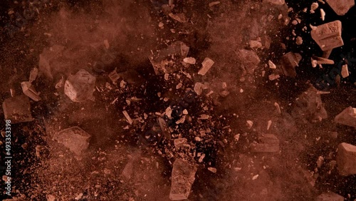 Super slow motion of rotating group of raw chocolate pieces on black background. Filmed on high speed cinema camera, 1000fps. Speed ramp effect.