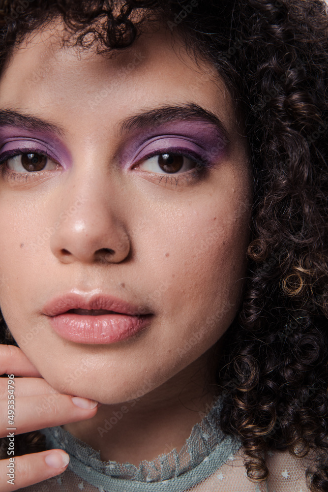 Model with curly afro hair and purple makeup Model with curly afro hair and purple makeup