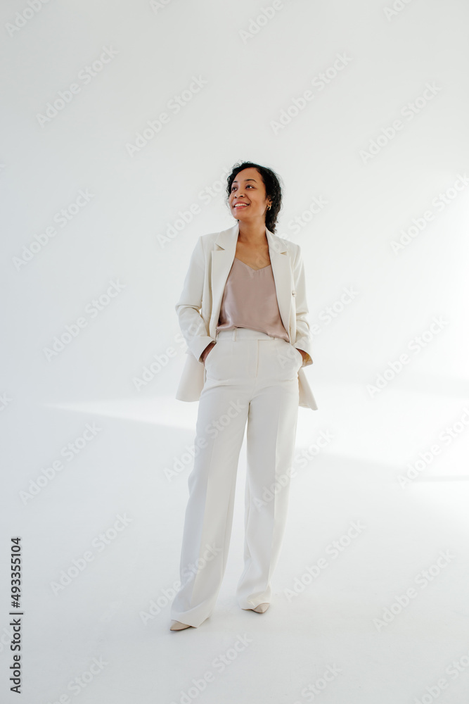 Black female entrepreneur with hands in pockets Black female entrepreneur with hands in pockets
