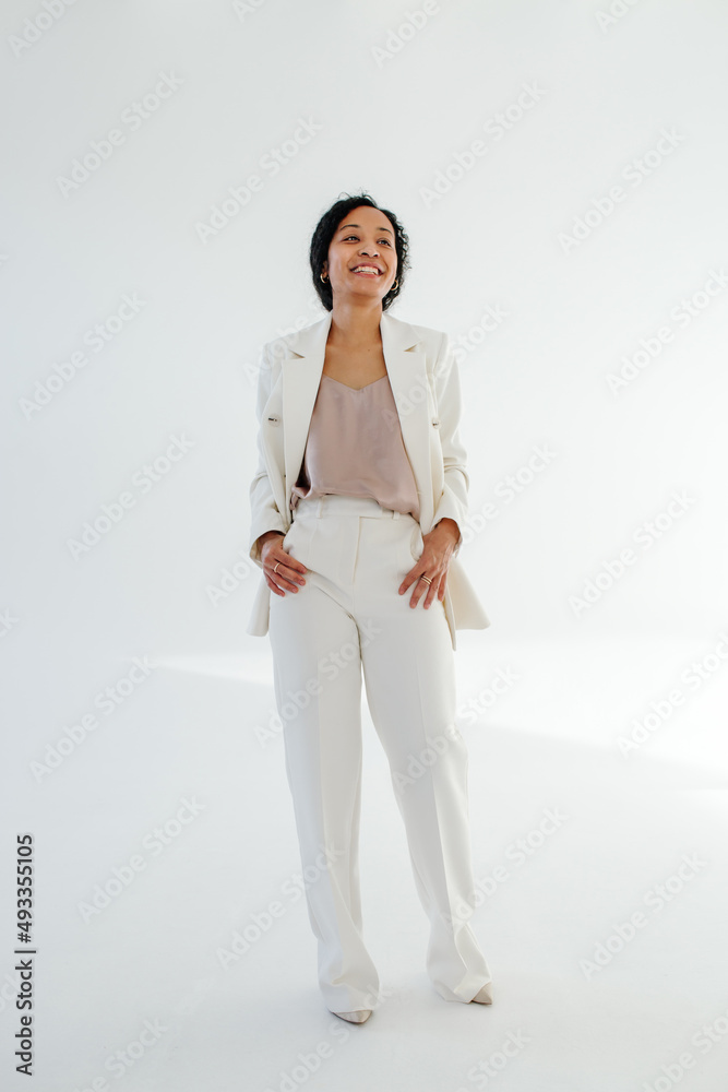 Black businesswoman standing with hands in pockets Black businesswoman standing with hands in pockets
