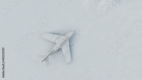 old abandoned aircraft in the snow, cold war concept
