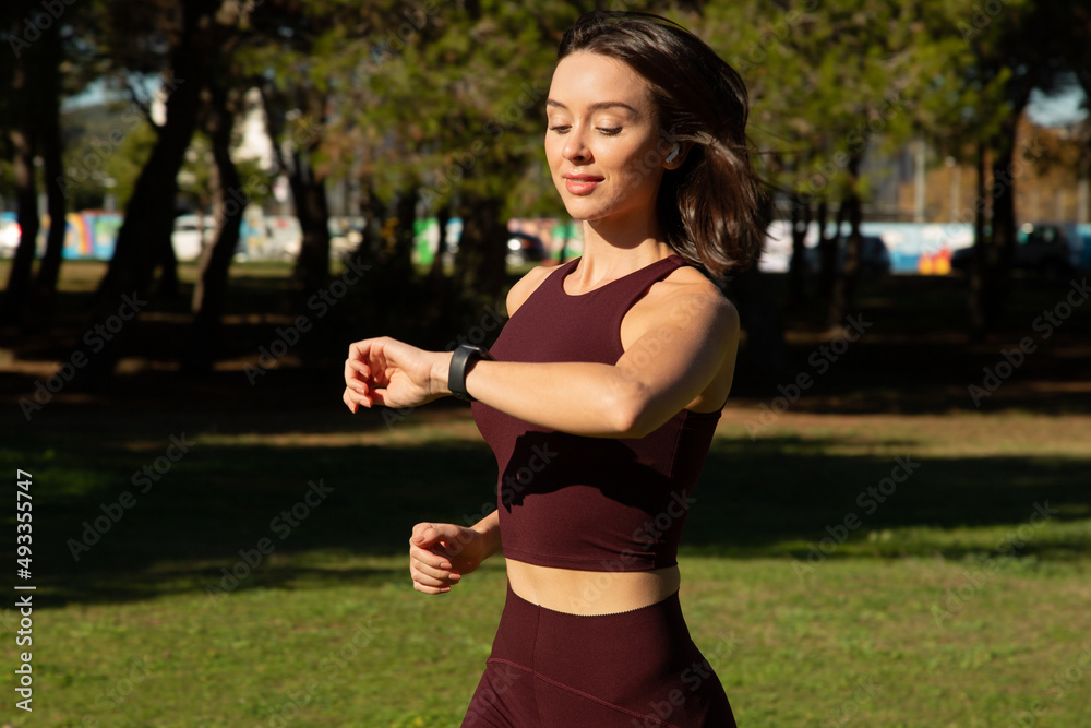 running woman checking watch running woman checking watch