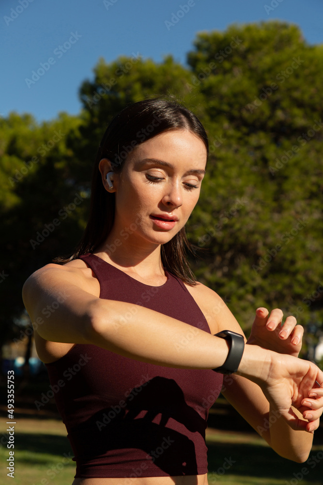 young woman using a wearable device young woman using a wearable device