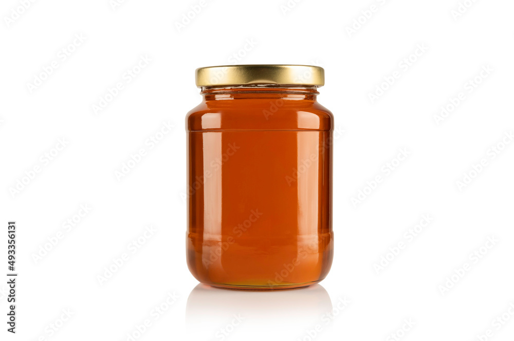 Glass jar with honey on white background. Glass jar with honey on white background.