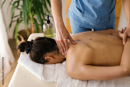 Caucasian female having professional massage at Spa photo