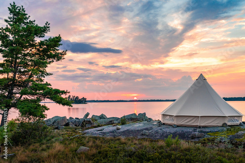 Bell Tent with Wind Swept Pines on Granite Wilderness Island photo
