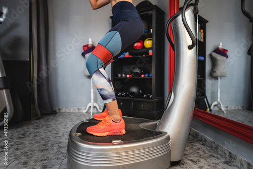 One woman training on the power plate machine female use powerplate for exercise photo