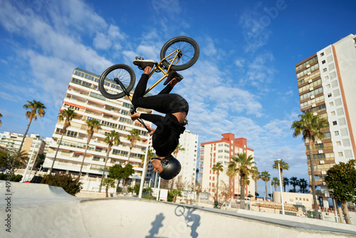Man showing trick on BMX bike photo