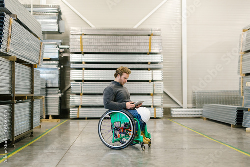 Man With A Disability Checking Production photo