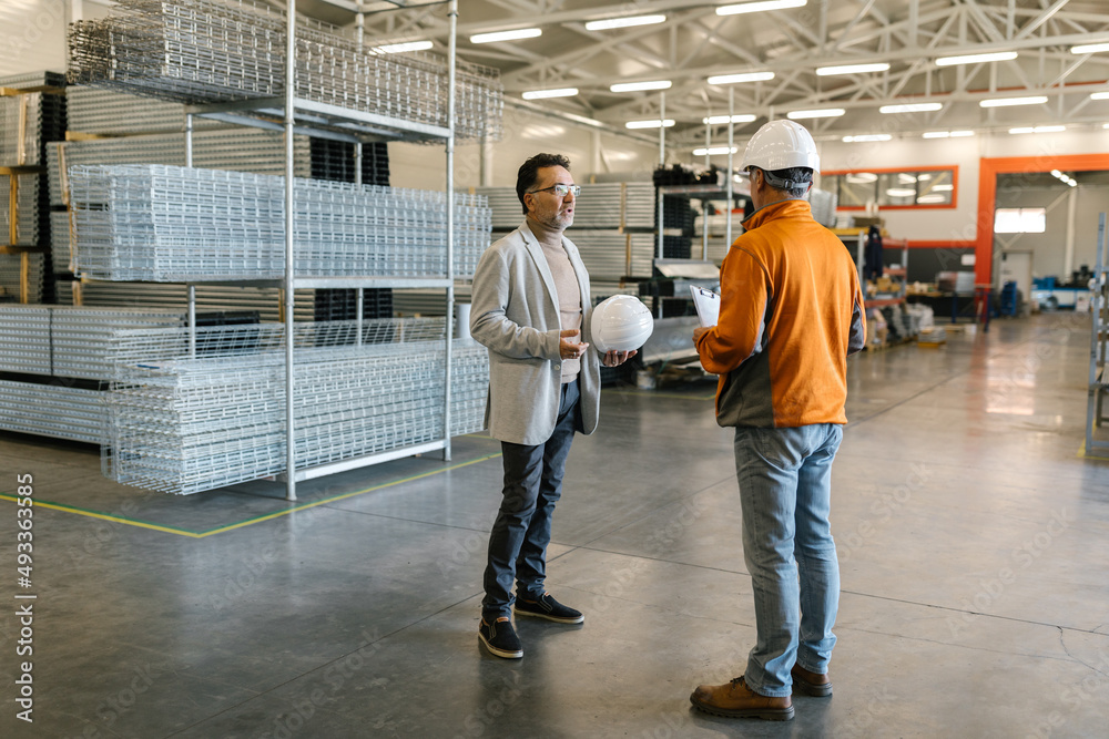 Manager With A Worker In A Warehouse