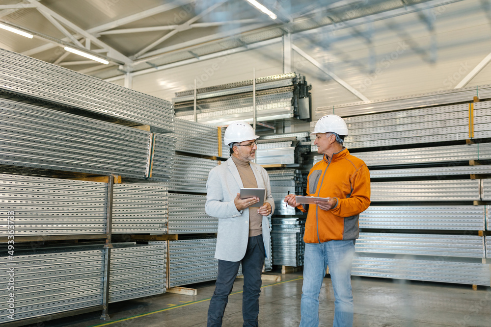 Supervisor In A Factory Inspection With A Worker Supervisor In A Factory Inspection With A Worker