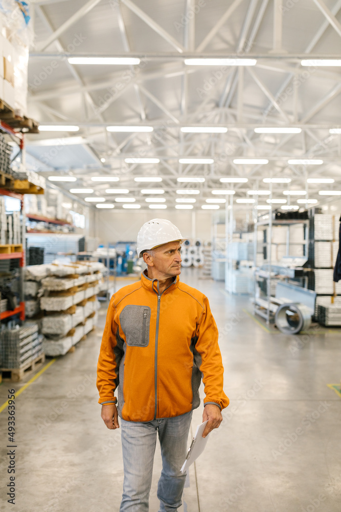 Senior Man In Inspection In A Factory Senior Man In Inspection In A Factory