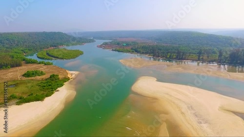 A beautiful drone shot of Aravali river in Goa, India. photo