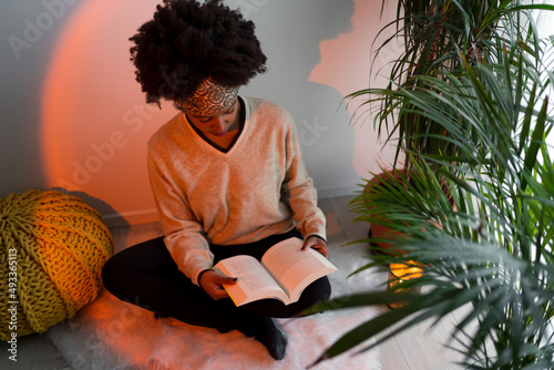 Woman reading at home photo
