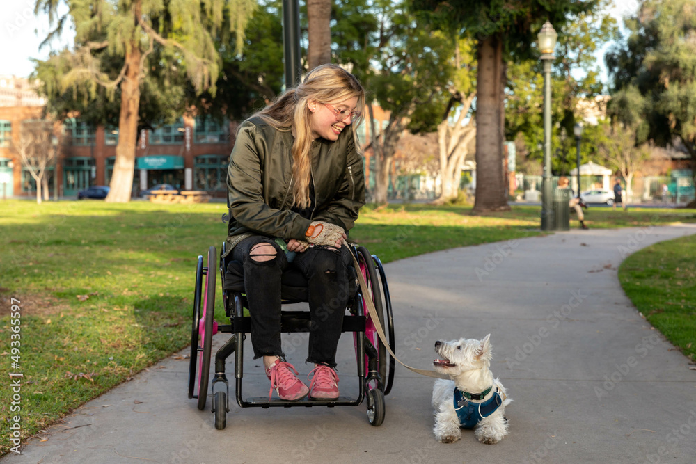 Disabled Woman and Dog Enjoy a Public Park Disabled Woman and Dog Enjoy a Public Park