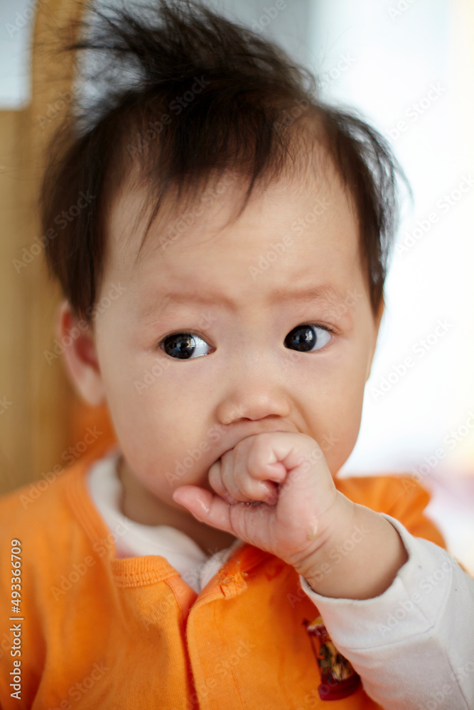 Close up funny expression of cute little Asian baby Close up funny expression of cute little Asian baby