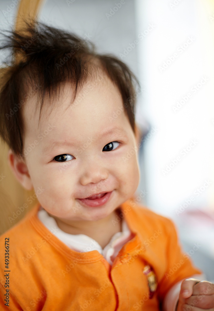 Close up funny expression of cute little Asian baby Close up funny expression of cute little Asian baby