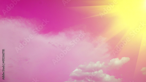 A sunny pink sky with white clouds is a beautiful natural setting for a background or illustration.