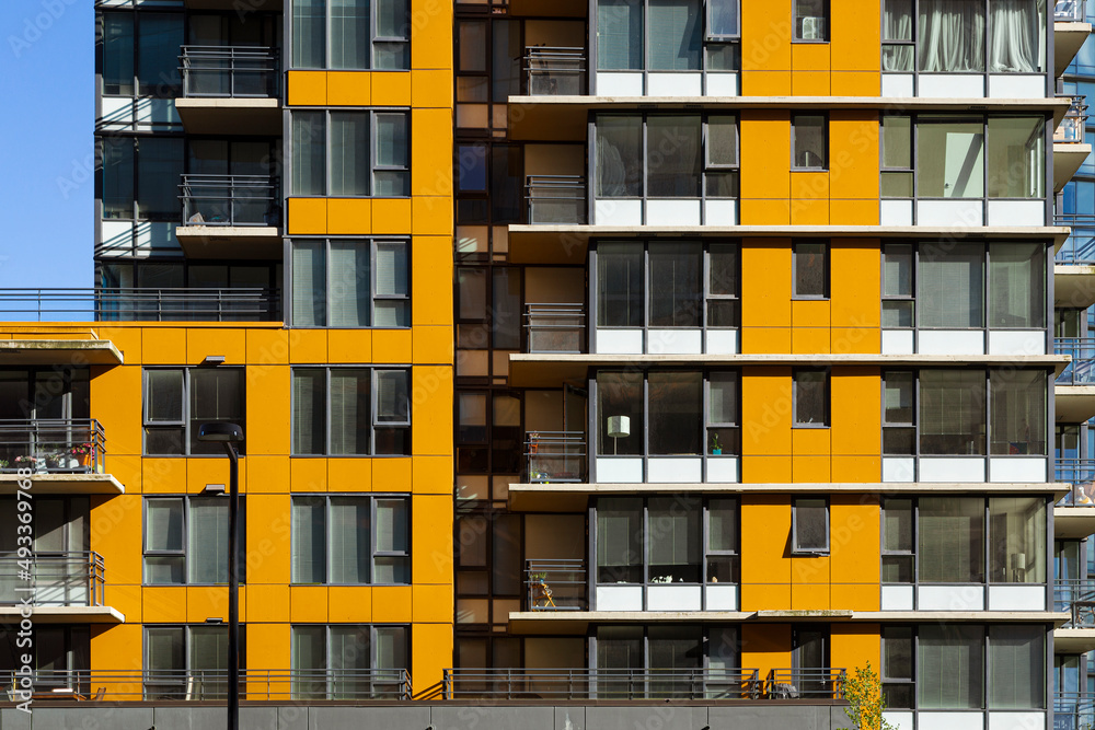 Front side of a apartment building with orange facade Stock Photo ...