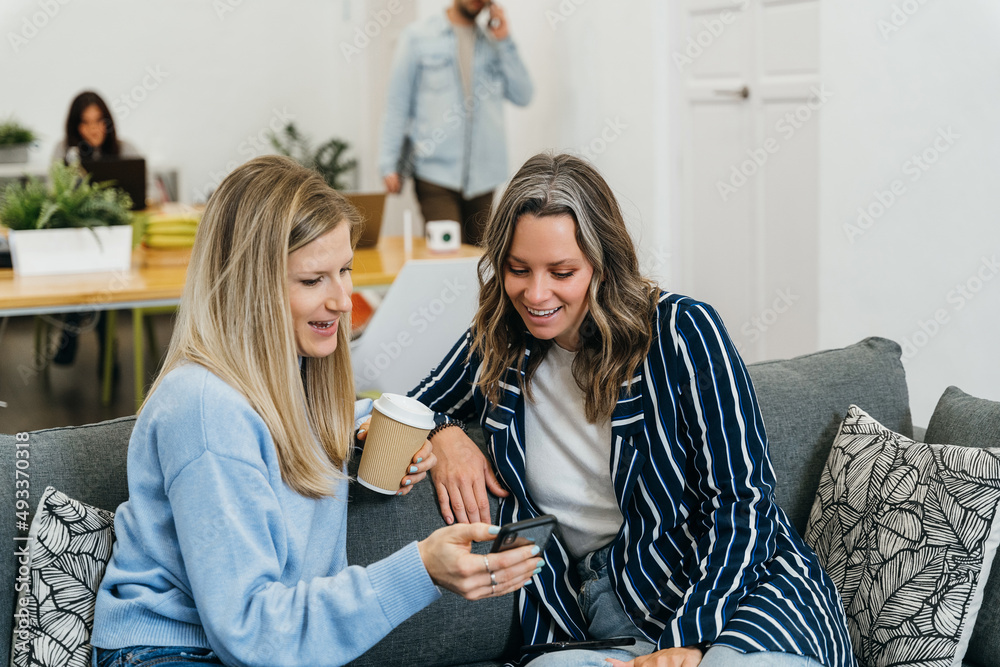 Positive colleagues having break in workplace Positive colleagues having break in workplace