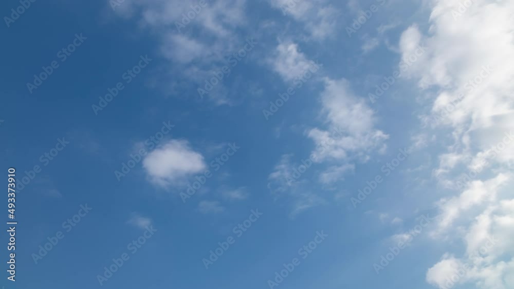 Long exposure time-lapse white clouds moving fast and blurred. Idyllic cloudy heaven abstract background. Timelapse clouds in blue sky on summer day Long exposure time-lapse white clouds moving fast and blurred. Idyllic cloudy heaven abstract background. Timelapse clouds in blue sky on summer day