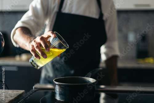 Pastry chef working in a modern kitchen photo
