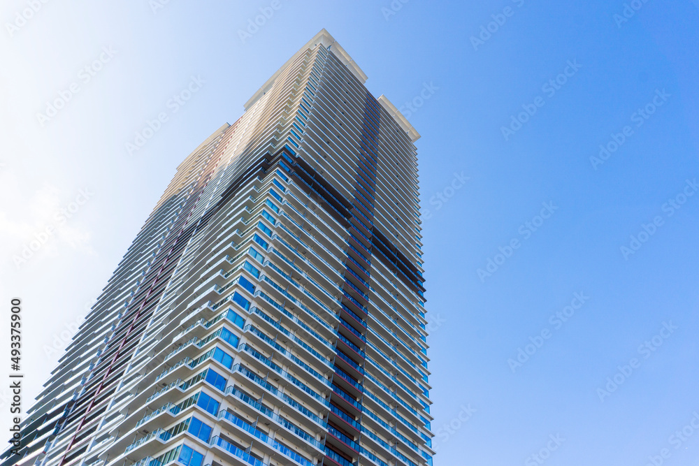 Landscape photograph looking up at a high-rise apartment_c_12