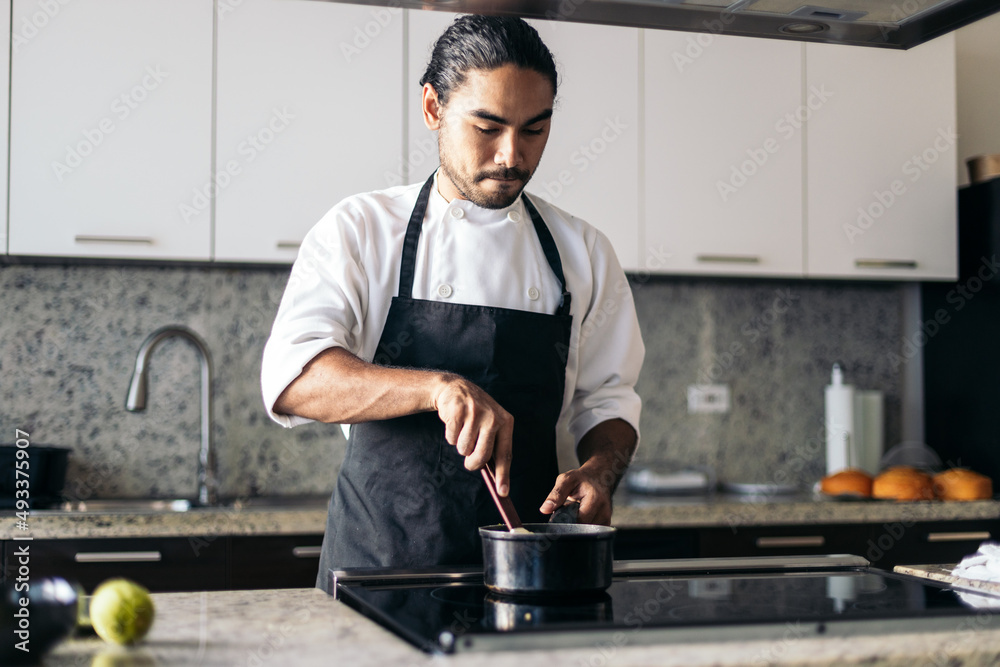 Pastry chef cooking in a kitchen Pastry chef cooking in a kitchen