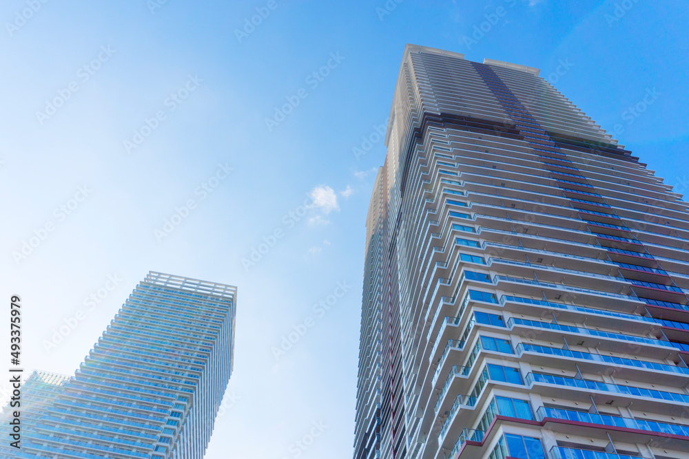 Landscape photograph looking up at a high-rise apartment_c_16