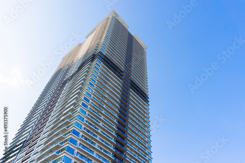 Landscape photograph looking up at a high-rise apartment_c_12