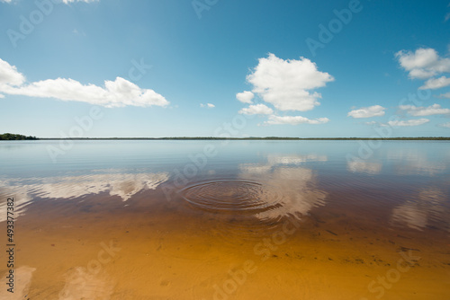 Mirror effect on lake water and little waves