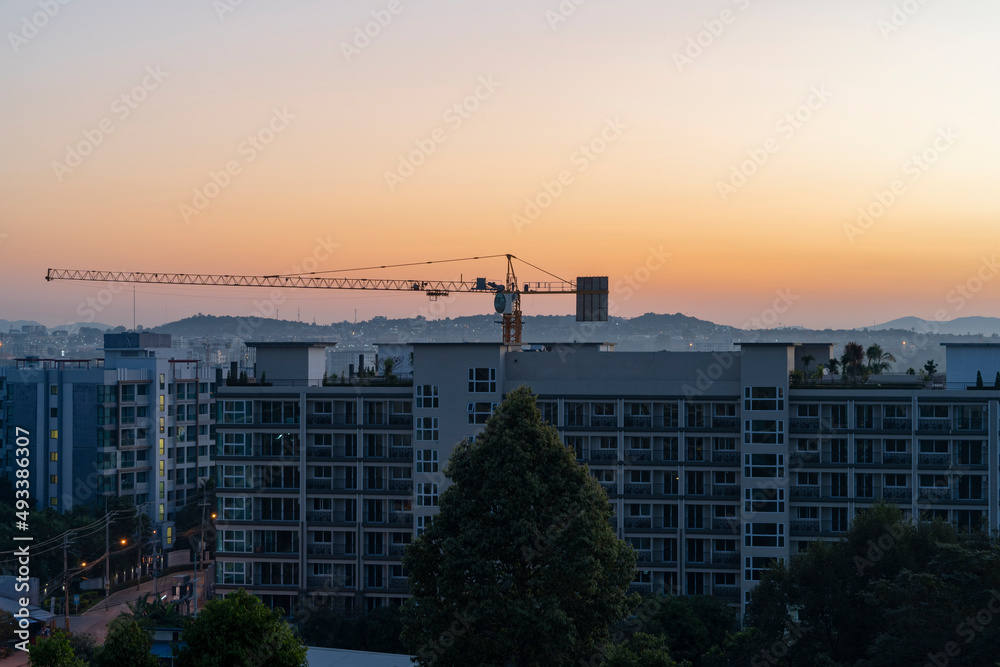 Construction crane at dawn in the city.