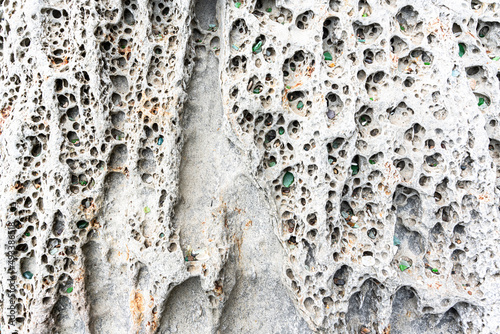 texture of porous stones on the beach, nature, natural phenomena, brown gray stones photo