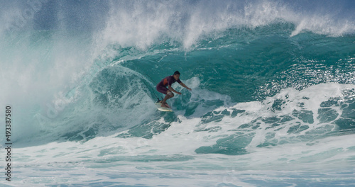 Photography Surfer surfing big tropical wave barrel tube at Banzai Pipeline in Hawaii