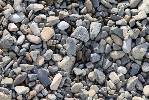 Sea pebble stones, background texture.