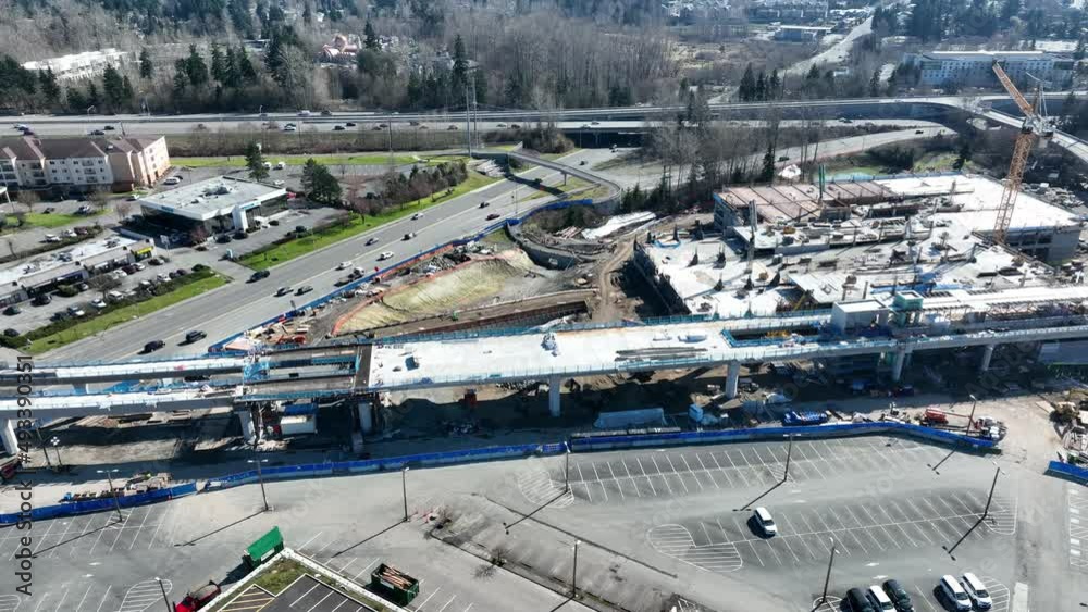 Cinematic 4K aerial drone trucking shot of the Lynnwood Transit Center Park and Ride construction, new Seattle Light Rail station, I-5 freeway with Lynnwood and Mountlake Terrace nearby Cinematic 4K aerial drone trucking shot of the Lynnwood Transit Center Park and Ride construction, new Seattle Light Rail station, I-5 freeway with Lynnwood and Mountlake Terrace nearby