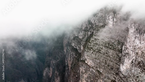 AERIAL - Cliff walls through the clouds, Sumidero Canyon, Chiapas, Mexico, forward photo